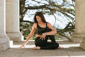 A woman exercising despite feeling unwell, showing determination and dedication to fitness.