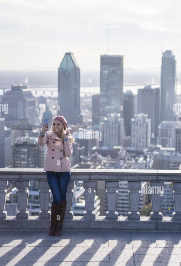 Vibrant city skyline framed by autumn foliage, with a woman explorer immersing herself in the urban landscape.