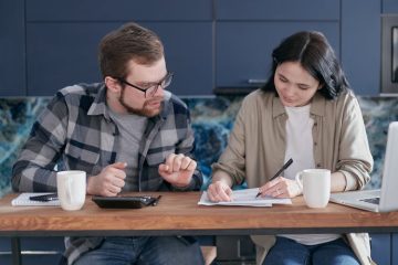 A couple discussing debt review and financial planning together