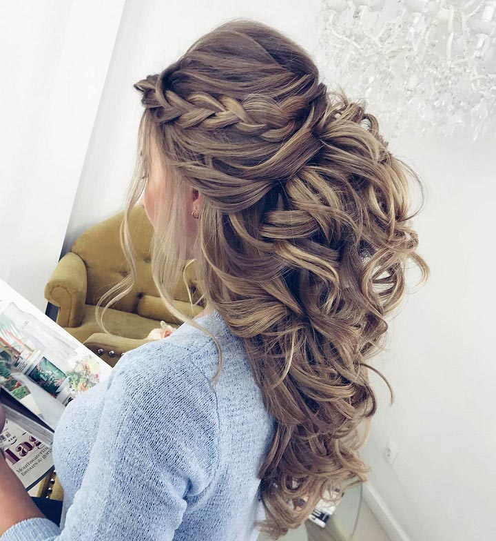 Half up hairstyle with side braid and curls