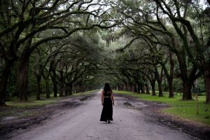 Image of a solo female traveler exploring a scenic destination.