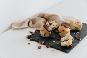 Image showcasing various chocolate decorations for baking, including shavings, curls, and ganache, adding visual appeal and indulgence to desserts.