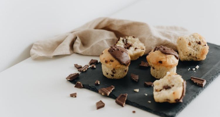 Image showcasing various chocolate decorations for baking, including shavings, curls, and ganache, adding visual appeal and indulgence to desserts.