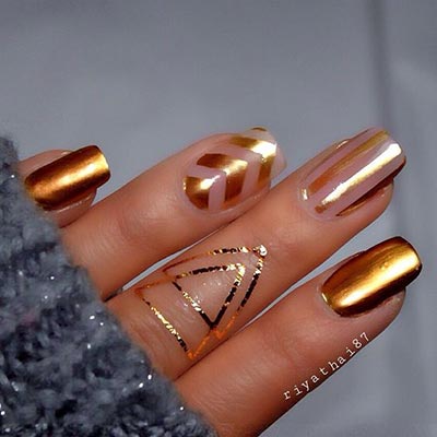 trendy negative space and gold nail art